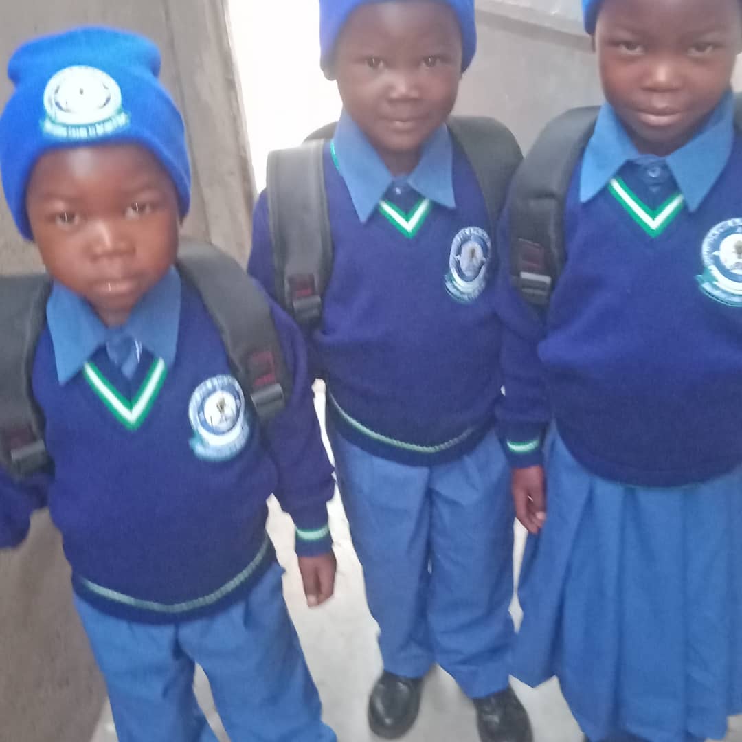 Child after sponsorship - neatly dressed in school uniform